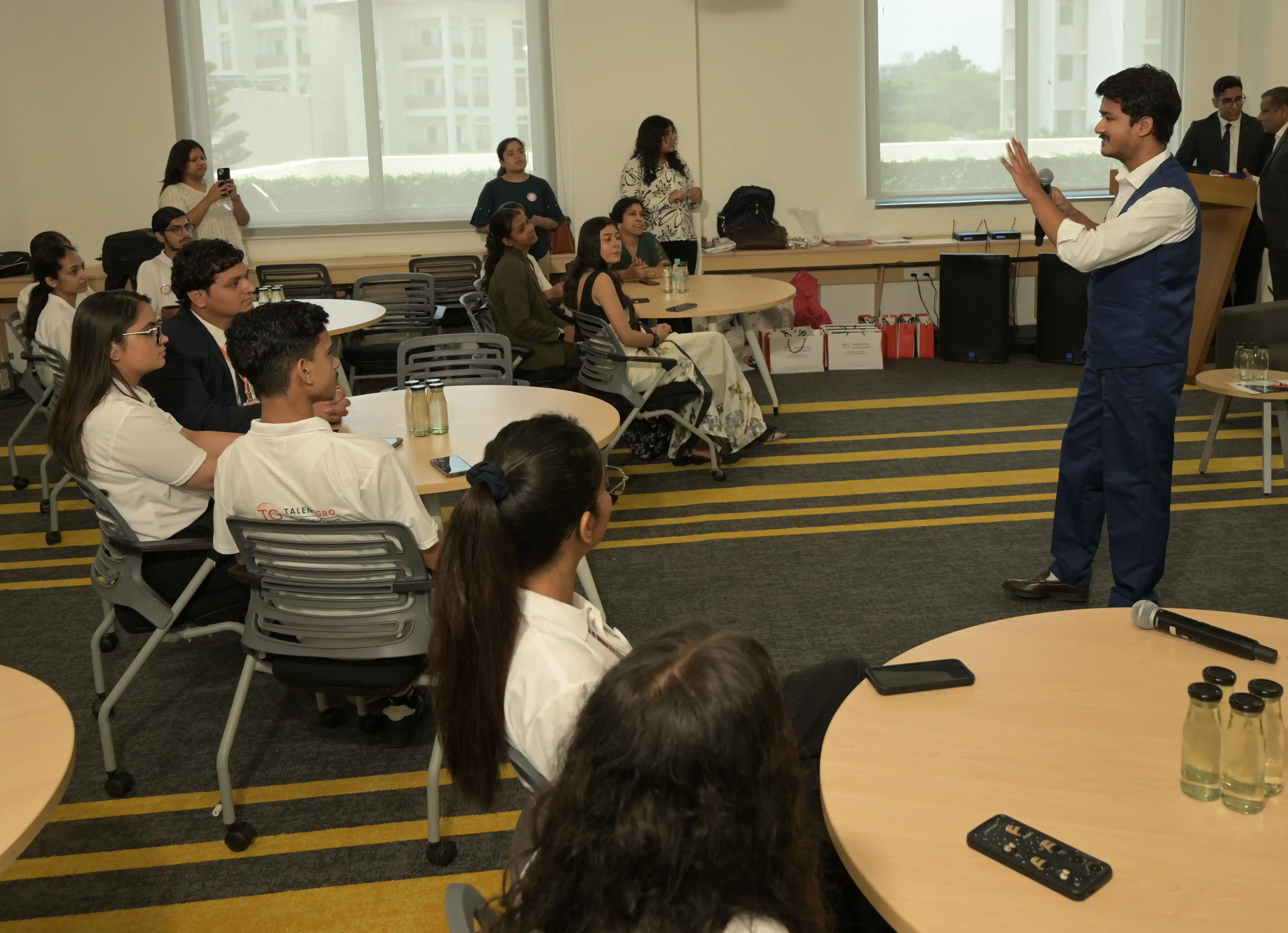 Students presenting startup ideas at a live pitch event